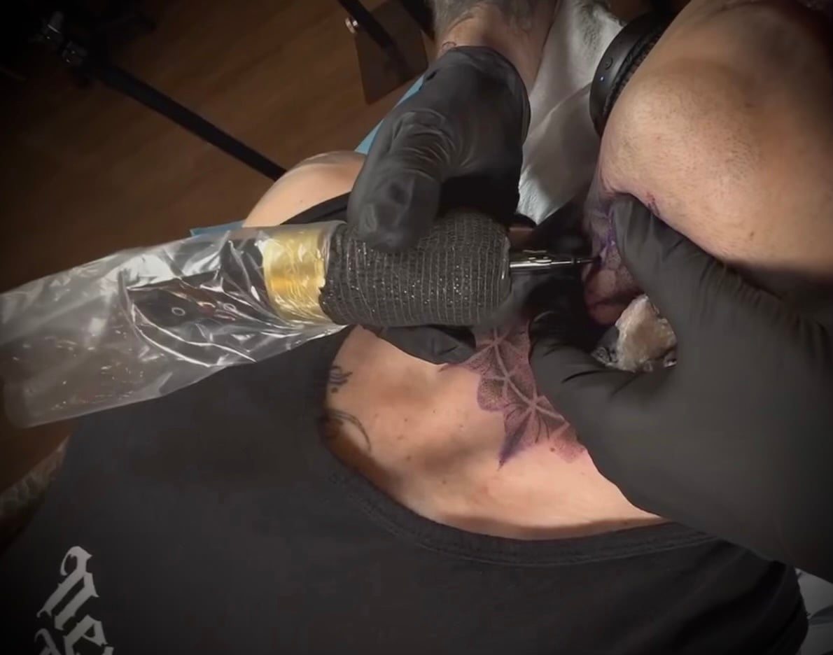 Tattoo artist at work at Revenant Tattoos